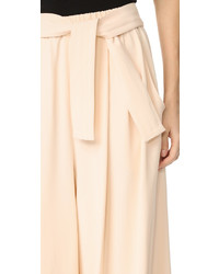 Розовые широкие брюки от Tome