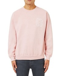 Розовый свитер с принтом