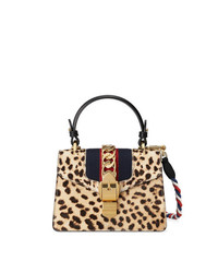 Светло-коричневая кожаная сумка-саквояж с леопардовым принтом от Gucci