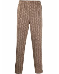 Светло-коричневые брюки чинос с принтом от Lacoste