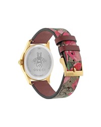 Женские светло-коричневые часы с цветочным принтом от Gucci
