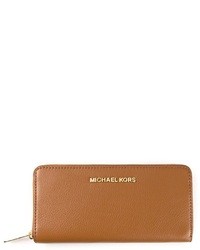 Светло-коричневый кожаный клатч от MICHAEL Michael Kors
