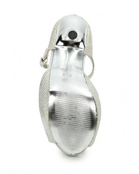 Серебряные босоножки на каблуке от Malien