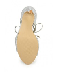 Серебряные босоножки на каблуке от Stephan