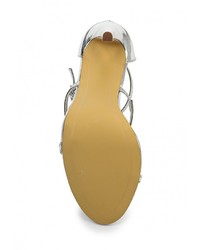 Серебряные кожаные босоножки на каблуке от Spurr