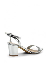 Серебряные кожаные босоножки на каблуке от Spurr