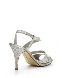 Серебряные кожаные босоножки на каблуке от Tamaris