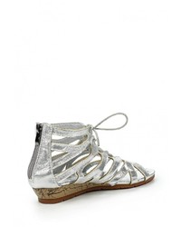 Серебряные кожаные сандалии на плоской подошве от Coco Perla