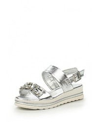 Серебряные кожаные сандалии на плоской подошве от Donna Moda