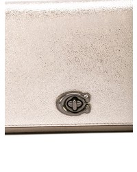 Серебряный кожаный клатч от Coach