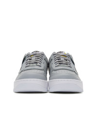 Женские серые кожаные низкие кеды от Nike