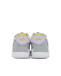 Женские серые кожаные низкие кеды от Nike