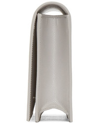 Серый кожаный клатч от Saint Laurent