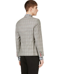 Мужской серый пиджак в шотландскую клетку от Thom Browne