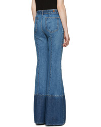 Синие джинсы-клеш от Alexander McQueen