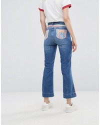 Синие джинсы-клеш от Wrangler