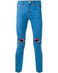 Синие зауженные джинсы с вышивкой