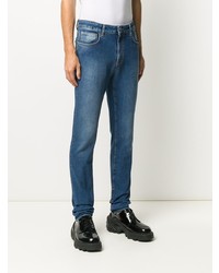 Мужские синие зауженные джинсы от Moschino