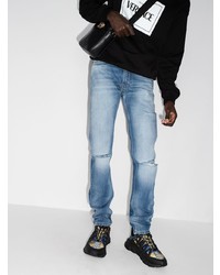 Мужские синие рваные джинсы от Versace