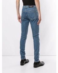 Мужские синие рваные зауженные джинсы от Balmain
