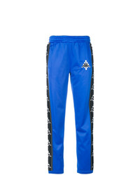 Женские синие спортивные штаны с вышивкой от Marcelo Burlon County of Milan