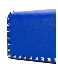 Синяя кожаная сумка через плечо с шипами от Valentino