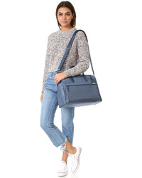 Женская синяя сумка от Tumi