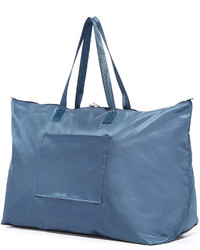 Женская синяя сумка от Tumi