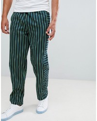 Темно-зеленые брюки чинос в вертикальную полоску