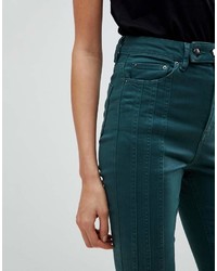 Темно-зеленые джинсы скинни