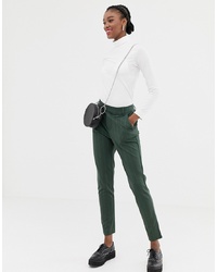 Темно-зеленые узкие брюки в вертикальную полоску