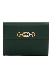 Темно-зеленый кожаный клатч от Gucci