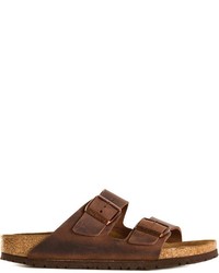 Темно-коричневые кожаные сандалии на плоской подошве от Birkenstock
