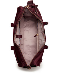 Женская темно-красная сумка от Tumi