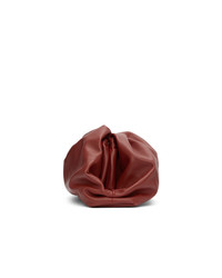 Темно-красный кожаный клатч от Bottega Veneta