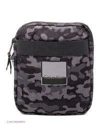 Темно-пурпурная сумка почтальона от Calvin Klein