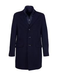Темно-синее длинное пальто от Manuel Ritz