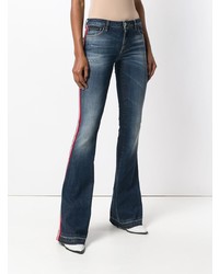 Темно-синие джинсы-клеш от Philipp Plein