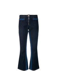 Темно-синие джинсы-клеш от Courreges