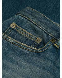 Темно-синие джинсы-клеш от Saint Laurent