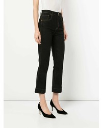 Темно-синие джинсы-клеш от Khaite