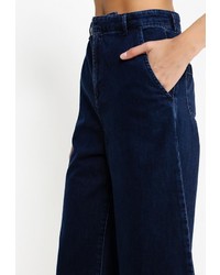 Темно-синие джинсы-клеш от Topshop