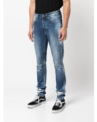 Мужские темно-синие рваные зауженные джинсы от Ksubi