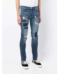 Мужские темно-синие рваные зауженные джинсы от True Religion