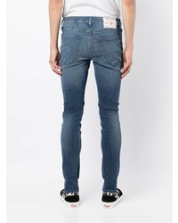 Мужские темно-синие рваные зауженные джинсы от True Religion