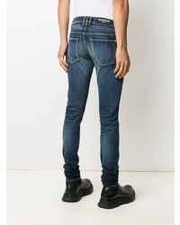 Мужские темно-синие рваные зауженные джинсы от Balmain