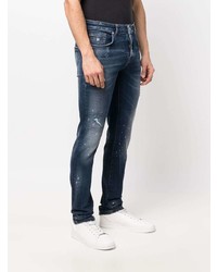 Мужские темно-синие рваные зауженные джинсы от John Richmond