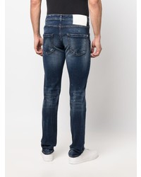 Мужские темно-синие рваные зауженные джинсы от John Richmond