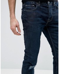 Мужские темно-синие рваные зауженные джинсы от AllSaints