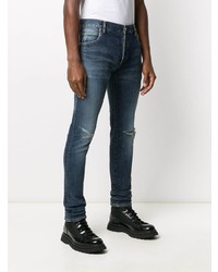 Мужские темно-синие рваные зауженные джинсы от Balmain